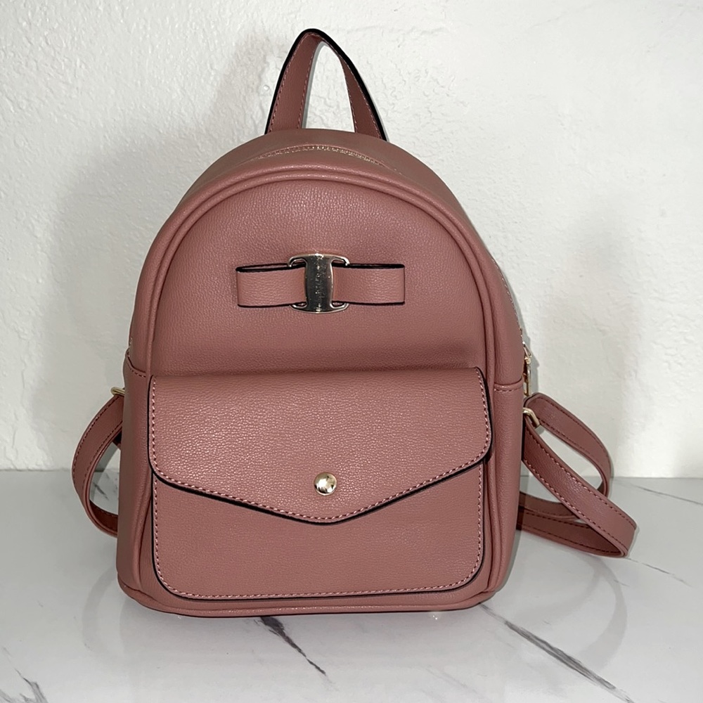 Never used tiny mauve backpack.